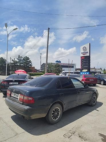 авто салона: Toyota Carina E: 1994 г., 1.6 л, Механика, Бензин, Седан — 6