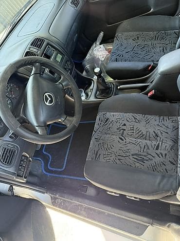 mercedesbenz 211: Mazda 323: 2000 г., Механика, Бензин, Универсал — 6
