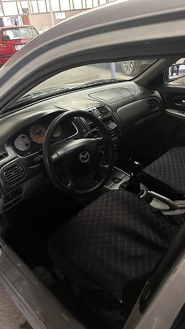 продаю трактор мтз 80: Mazda 323: 2003 г., 1.6 л, Механика, Бензин, Хэтчбэк — 5