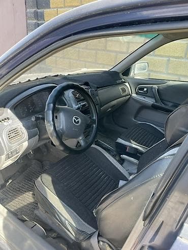 mazda 2: Mazda 323: 2001 г., 1.6 л, Механика, Бензин, Хэтчбэк — 7