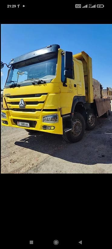 экскаватор w60: Самосвал Howo (CNHTC) 371, желтый. - Колесная формула 6x4. - Мощность — 6