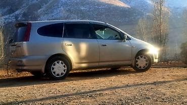 Дома: Honda Stream, 7‑местный компактвэн Основные характеристики: - Кузов — 1