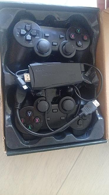 Видеоигры и приставки: Игровая ТВ-приставка Game Stick Lite 2.4G с двумя беспроводными — 2