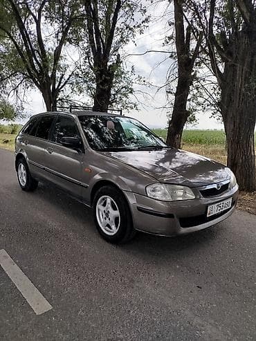 step wgn: Mazda 323: 1999 г., 1.6 л, Механика, Бензин, Универсал — 3