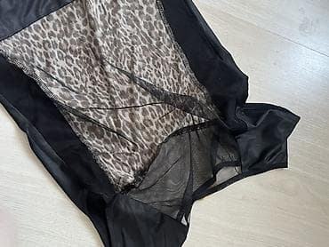 леопардовое платье: Платье с леопардовым принтом и контрастными чёрными вставками. - — 6