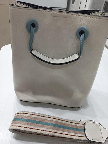 Аксессуары: Женская сумка-ведро (bucket bag) из фактурного кожаного материала в — 1