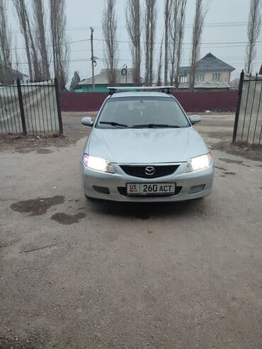 100 перехотка: Mazda 323: 2001 г., 2 л, Механика, Бензин, Хэтчбэк — 7