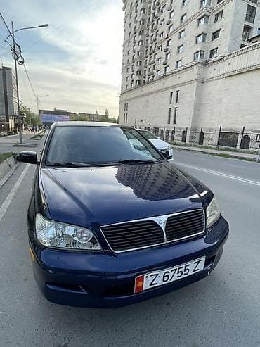 daewoo leganza: Mitsubishi Lancer-2003, объем 2. Седан компакт-класса, темно-синего — 3