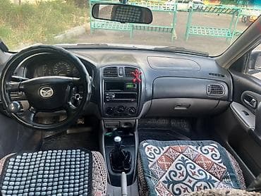 e 303: Mazda 323: 2001 г., 1.6 л, Механика, Бензин, Универсал — 6