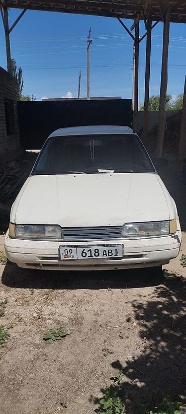Транспорт: Mazda 626: 1991 г., 2 л, Механика, Бензин, Седан — 1