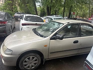 mazda 121: Mazda 323: 1996 г., 1.5 л, Механика, Бензин, Седан — 2