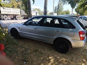 мото номер: Mazda 323: 2001 г., 1.6 л, Механика, Бензин, Хэтчбэк — 1