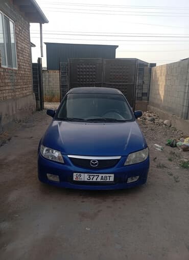 набор ключей для автомобиля в чемодане: Mazda 323: 2001 г., 1.6 л, Механика, Бензиновая — 1