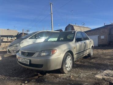 таха: Mazda 323: 1999 г., 1.6 л, Автомат, Бензин, Седан — 1