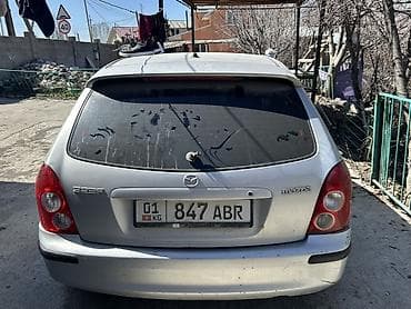 мазда 323 крыло: Mazda 323: 2002 г., Бензин, Универсал — 1