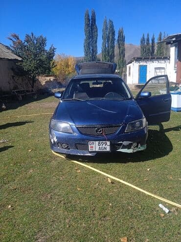 диски на опель зафира а: Mazda Familia: 2002 г., 1.6 л, Автомат, Бензин, Хэтчбэк — 3