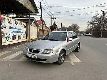 golf variant: Mazda 323: 2002 г., 1.6 л, Механика, Бензин, Седан — 1
