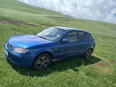 man 8: Mazda 323: 2003 г., 1.6 л, Механика, Бензин, Хэтчбэк — 2