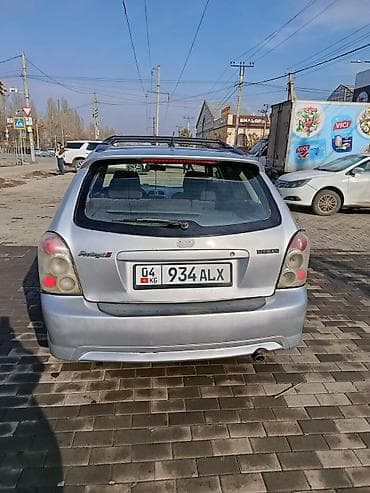 65 style: Mazda Protege: 2003 г., 2 л, Механика, Бензин, Универсал — 2