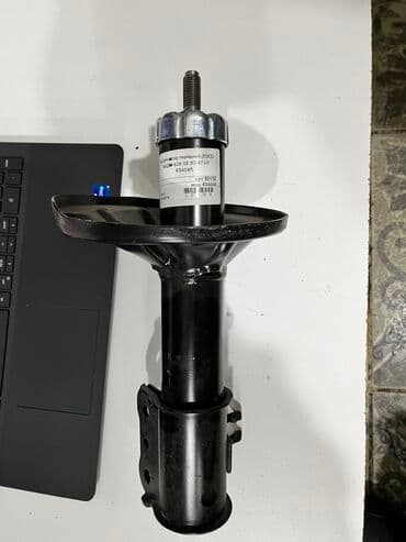 ge: Передний амортизатор Mazda 1997 г., Новый — 2