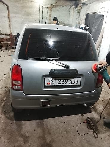 Daihatsu Cuore: 2002 г., 1 л, Автомат, Бензин, Хетчбек