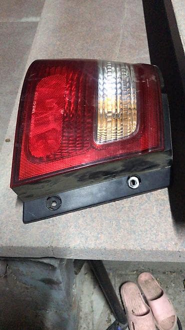 Системы освещения: Левый поворотник Nissan 1998 г., Б/у, Оригинал — 2
