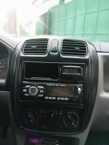 новое авто: Mazda Demio: 2002 г., 1.3 л, Механика, Бензин, Хэтчбэк — 6