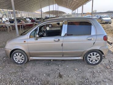 зимный шыны: Хэтчбек Daewoo Matiz серого цвета с четырьмя дверями и компактным — 4