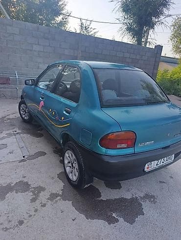 smart car: Mazda 121: 1991 г., 1.3 л, Механика, Бензин, Седан — 6
