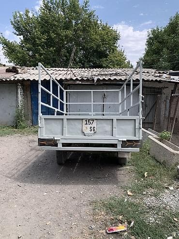 Прицеп одноосный бортовой с каркасом под тент/надставные борта