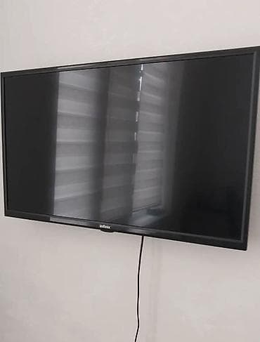 монитор 25: Телевизор Infinix, диагональ около 32–40". Плоская LED‑панель с — 1