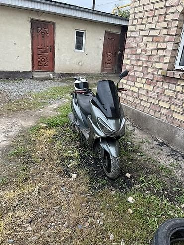 скутор новый: Скутер/максискутер серо‑черного цвета Описание: - Городской скутер с — 3