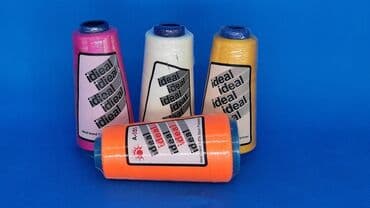 купить швейную машинку для шитья кожи: ХБ нити фирмы Идеал. Нитки для пошива одежды. Разная палитра цветов — 1