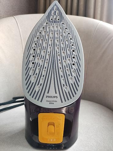 Уход за одеждой: Утюг Philips DST7061 Характеристики: Постоянная подача пара: 55 г/мин — 6