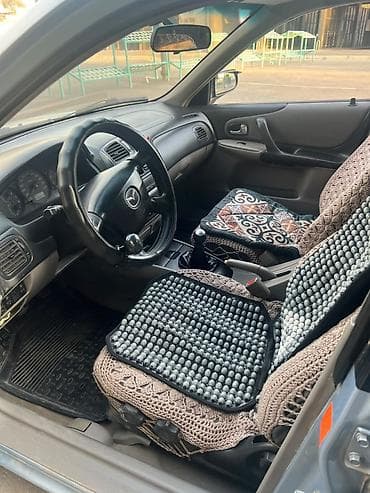 e 303: Mazda 323: 2001 г., 1.6 л, Механика, Бензин, Универсал — 8