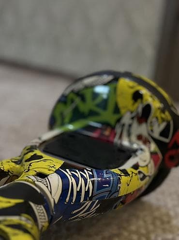 стоимость гироскутера: Гироскутер с ярким граффити-дизайном - Компактная двухколёсная модель — 1