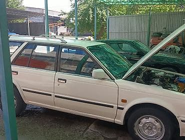 машина byd e2: Nissan Sunny: 1990 г., Бензин, Универсал — 6