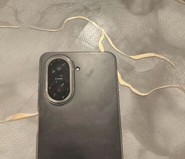 аирподс мах: Смартфон с большим безрамочным дисплеем и центральным вырезом под — 1