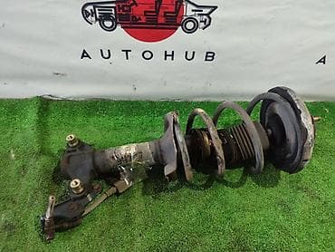Автозапчасти: Передний амортизатор Nissan 2003 г., Оригинал — 1