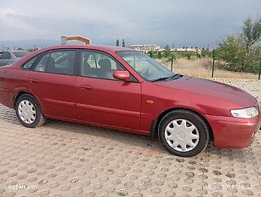 down pipe: Mazda 626: 2000 г., 2 л, Механика, Бензин, Хэтчбэк — 10