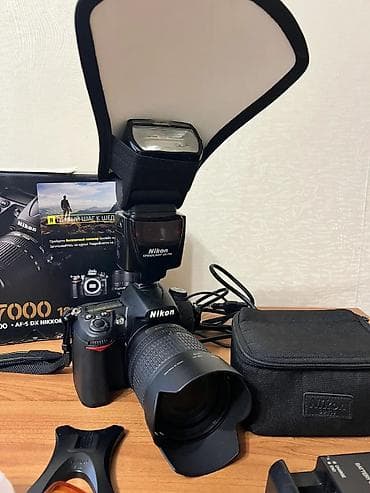 Фото жана видеокамералар: Зеркальная фотокамера Nikon D7000 с универсальным зум-объективом и — 7