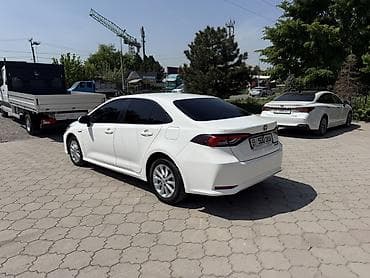 усилитель камри: Toyota Corolla: 2022 г., Вариатор, Гибрид, Седан — 5