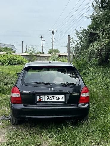 Унаа сатуу: Mazda 323: 1999 г., 1.5 л, Кол менен иштөөчү, Бензин, Хетчбек — 3
