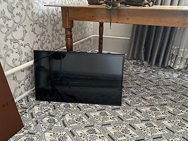 колонки 5 1: Телевизор NISVA с диагональю около 32–37". Плоская LED‑панель — 4
