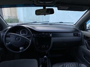 Унаа: Chevrolet Lacetti: 2006 г., 1.4 л, Кол менен иштөөчү, Бензин, Седан — 6