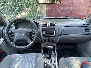 Транспорт: Mazda 323: 2003 г., 1.6 л, Автомат, Бензин, Универсал — 5