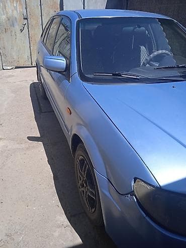 мтз 1021: Mazda 323: 2002 г., 1.6 л, Механика, Бензин, Хэтчбэк — 1