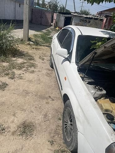 Продажа авто: Daewoo Magnus: 2004 г., 2 л, Механика, Бензин, Седан — 4