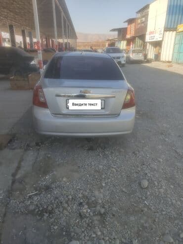 дом на калеса: Шевролет Лачетти Седан светло‑серебристого цвета. Основные — 4