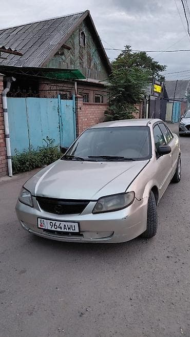 авто крепеж: Mazda Protege: 2001 г., Автомат, Бензин, Седан — 1